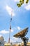 Signal Tower and satellite dish The sky is big and the clouds ar