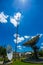 Signal Tower and Sky satellite dish are large and the clouds are white as a backdrop, high telecommunication signal, wireless