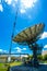 Signal Tower and Sky satellite dish are large and the clouds are white as a backdrop, high telecommunication signal, wireless