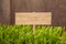 Signboard on Grass background of wood planks,