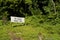 signboard `Pos Kawalan Santuari Kelah` meaning Kelah Sanctuary control post on a small island in Kenyir Lake, Malaysia