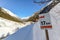 Signpost at Cross-country skiing trail through the Pitztal near Sankt Leonhard in Tirol, winter sports in snowy landscape in the