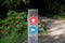 Signpost in a forest marking 2 different paths to take