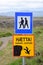 A signpost in Iceland with two signs for hikers