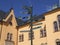 Signpost in Linkoeping in front of a yellow building.