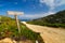 Signpost pointing to the beach at La Revellata in Corsica