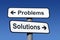 Signpost pointing to problems and solutions.