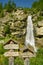 Signposts showing directions under the Fellbach waterfall close to Saas-Balen village