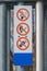 Signs for no smoking, open flame or cellphones, close up