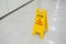 Signs plastic yellow put on floor text caution wet floor