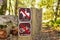 Signs posted at the entrance on one of the hiking trails, warning that it is closed to bikes and horses, Purisima Creek Redwoods