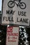 Signs telling of bike lane use and parking limits