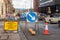 Signs and Traffic Cone at a Roadworks Site