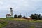 Signs welcome visitors to the lighthouse at Cape Blanco State Park, Oregon, USA