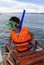 SIHANOUKVILLE, CAMBODIA - MAY. 18, 2014: A little boy in a mask for snorkeling goes down in the sea near Sihanokville, Cambodia on