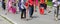 Sikh people with brooms on the street during the religious cerem