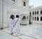 Sikh people standing at the Golden Temple in Amritsar, India