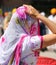 Sikh woman with veil on her head during a religious celebration