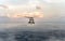 Sikorsky MH-60S Seahawk helicopter of Royal Thai navy flies or hops over the sea surface during the search and rescue at sea