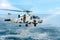 Sikorsky SH-60B Seahawk  helicopter of U.S.Navy hover above the sea surface with rainbow