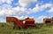 Silage and forage harvesting equipment is standing on the edge of the field, waiting for work. A harvester near  field, before