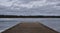 Silence at the lake with a view into the distance over a wide footbridge