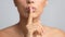 Silent gesture. Woman holding finger on lips