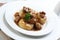 Silesian dumplings on white plate