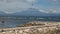 The silhoette of Mount Agung - sleeping Bali volcano, the view from the Sanur beach over the sea with waves. Sunny day, almost no