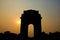 Silholuette of gate of india arch in new delhi india at sunset with tourists crowd