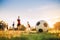 Silhouette action sport outdoors of diversity of kids having fun playing soccer football for exercise in community rural area unde