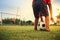 Silhouette action sport outdoors of a group of kids having fun playing soccer football for exercise in community under