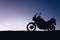 silhouette adventurous motorcycle on blue sunset sky, motorcycle touring background, adventure and travel concept, active