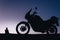 silhouette adventurous motorcycle on blue sunset sky with people, motorcyclists, motorcycle touring background, adventure and