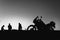 silhouette adventurous motorcycle on blue sunset sky with people, motorcyclists, motorcycle touring background, adventure and