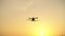 Silhouette, Agricultural drone in the sky with evening light