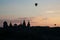 Silhouette of air balloon parade over Kamianets-Podilskyi Castle in Ukraine