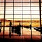 Silhouette of airline passengers in an airport