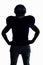 Silhouette American football player standing with hand on hip