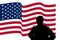 Silhouette of an American soldier facing waving USA national flag,  white background