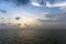 Silhouette of an anchor handling tug boat at oil field during sunrise