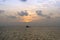 Silhouette of an anchor handling tug boat at oil field during sunrise