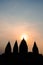 Silhouette of the ancient Prambanan temple during sunset.