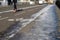 Silhouette of anonymous female jogger running on winter city bicycle lanes