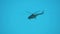 Silhouette army helicopter doing patrols while flying over downtown. Flying helicopters in the sky lifestyle