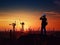 Silhouette of asian engineer and worker inspecting project at construction site background