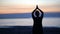 Silhouette Asian senior woman doing yoga at morning beach