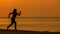Silhouette athletic woman jogging exercise and relax and freedom on sand beach