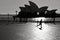 Silhouette of Australian man runs near the Opera House