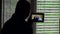 Silhouette of a bald man and his friends communicate via video chat on a tablet. Self-isolation, quarantine, the concept